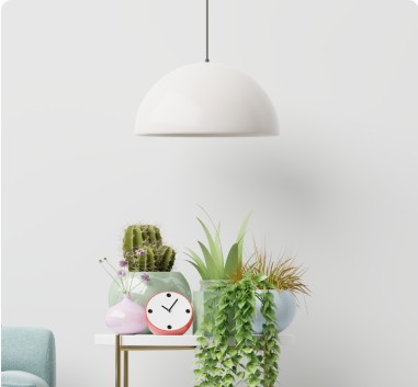 White pendant lamp above a side table with potted plants